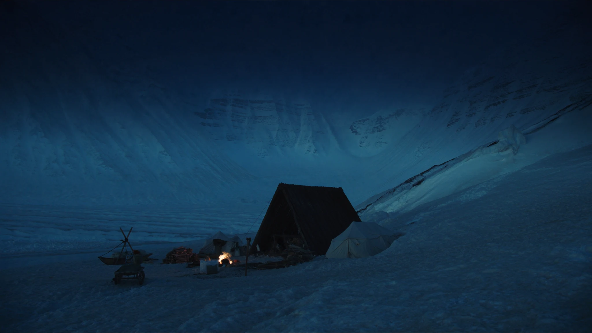 A winter survival camp beneath snow-covered mountains in Norway